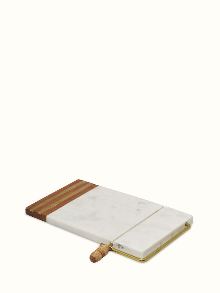 Angle view of Marble Inlaid Cheese Board by Swadesh showing off the luxurious marble inlays and sleek finish of the board.