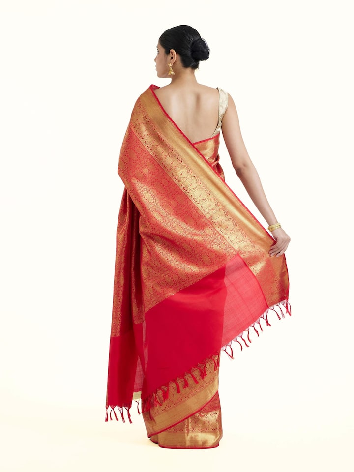 Back view of pink silk Kancheepuram saree displaying ornate pallu design