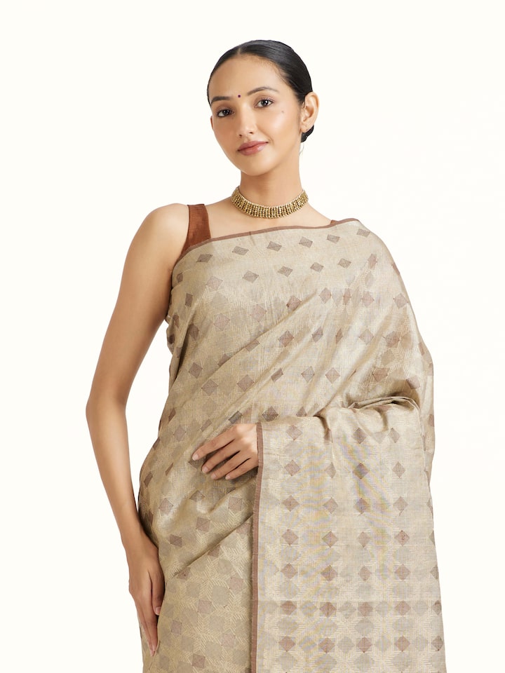 Angled view of the Beige Tussar Silk Saree