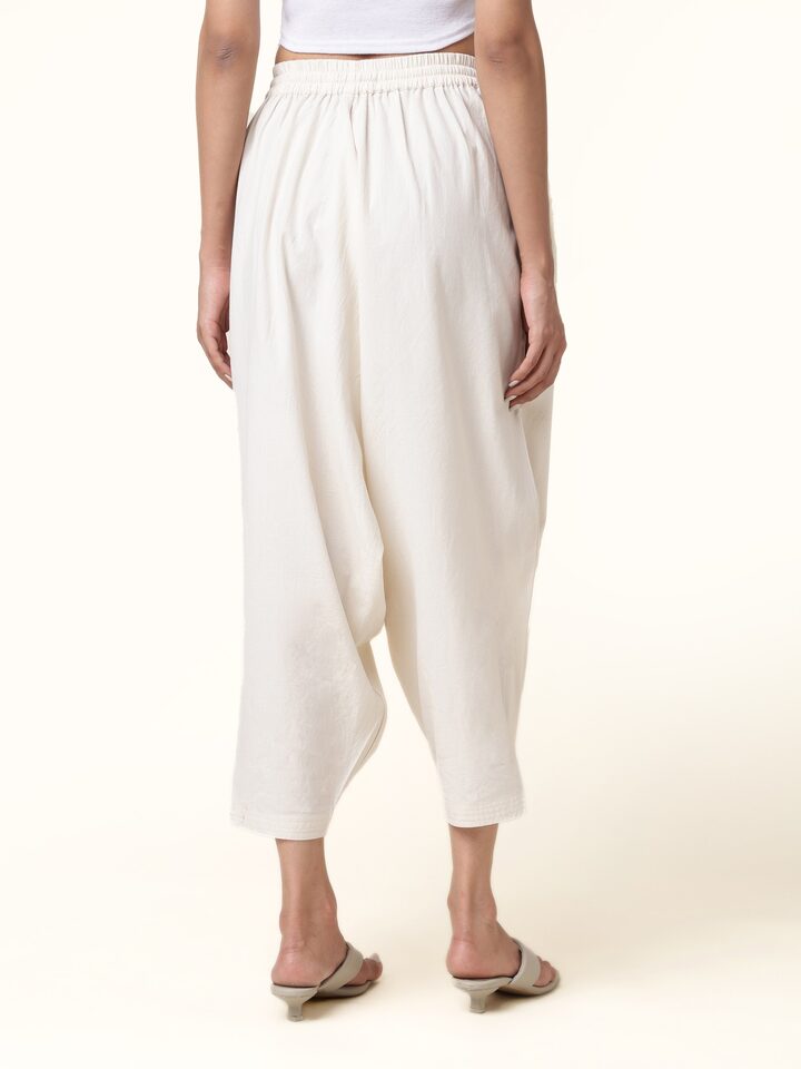 Back view of cotton harem pants highlighting wide fit and airy cotton fabric