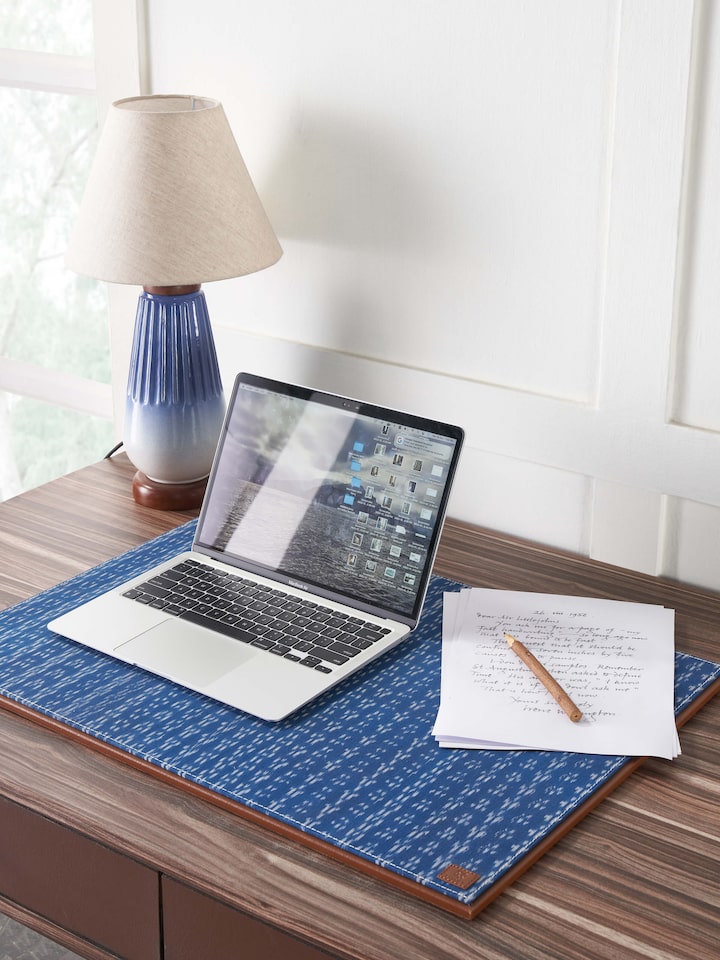 Side view of Swadesh Leather Desk Blotter in blue showing its refined craftsmanship and sleek profile.