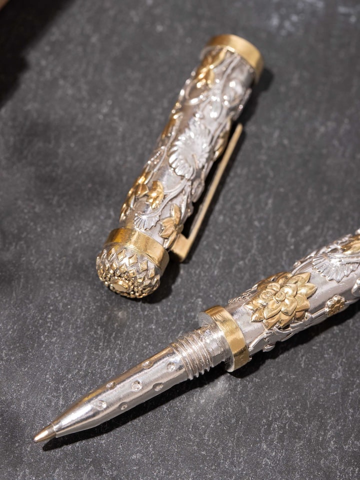 Detail view of Silver Smithing Silver Pen highlighting the stone setting and metalwork detail