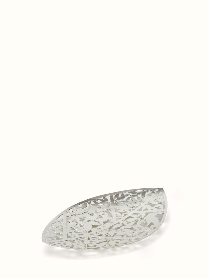 Close-up view of silver-plated leaf platter, highlighting its texture and detailed leaf design.