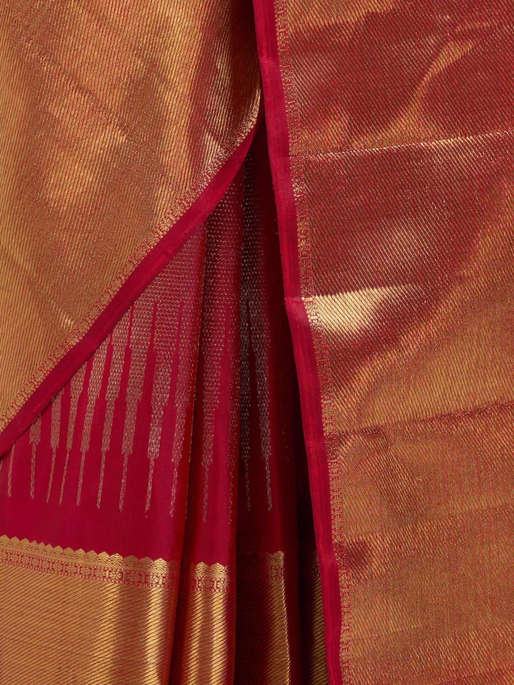 Detail view of red silk Kancheepuram saree showing silk texture and zari craftsmanship