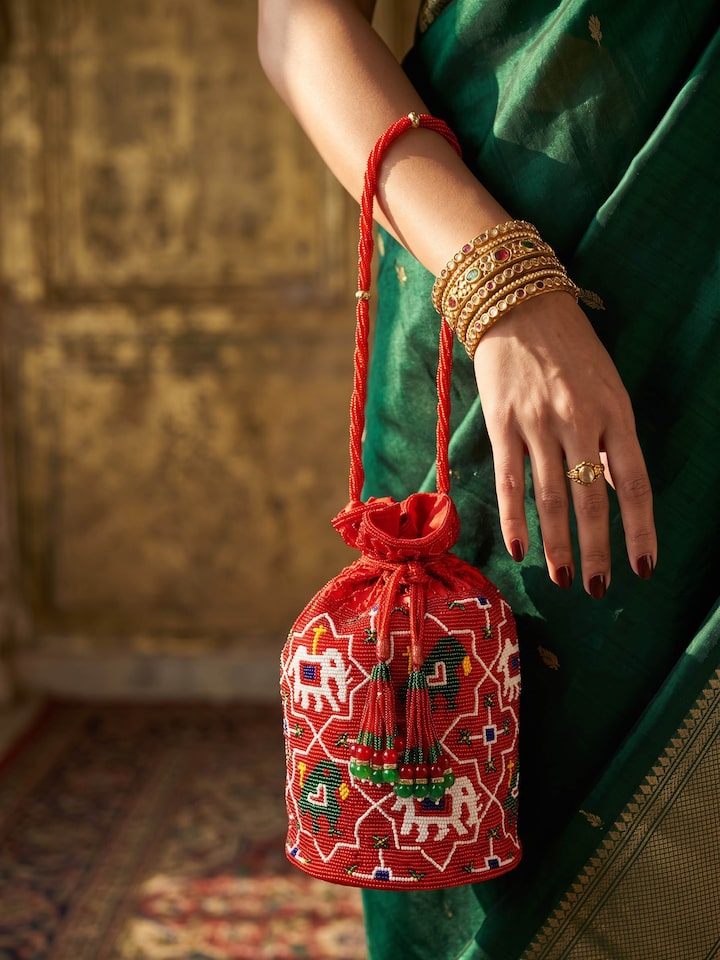 Styled view of Beadwork Red Potli Bag styled with an outfit