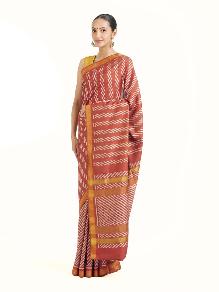 Side view of pink mulberry silk Patola saree showcasing structured drape