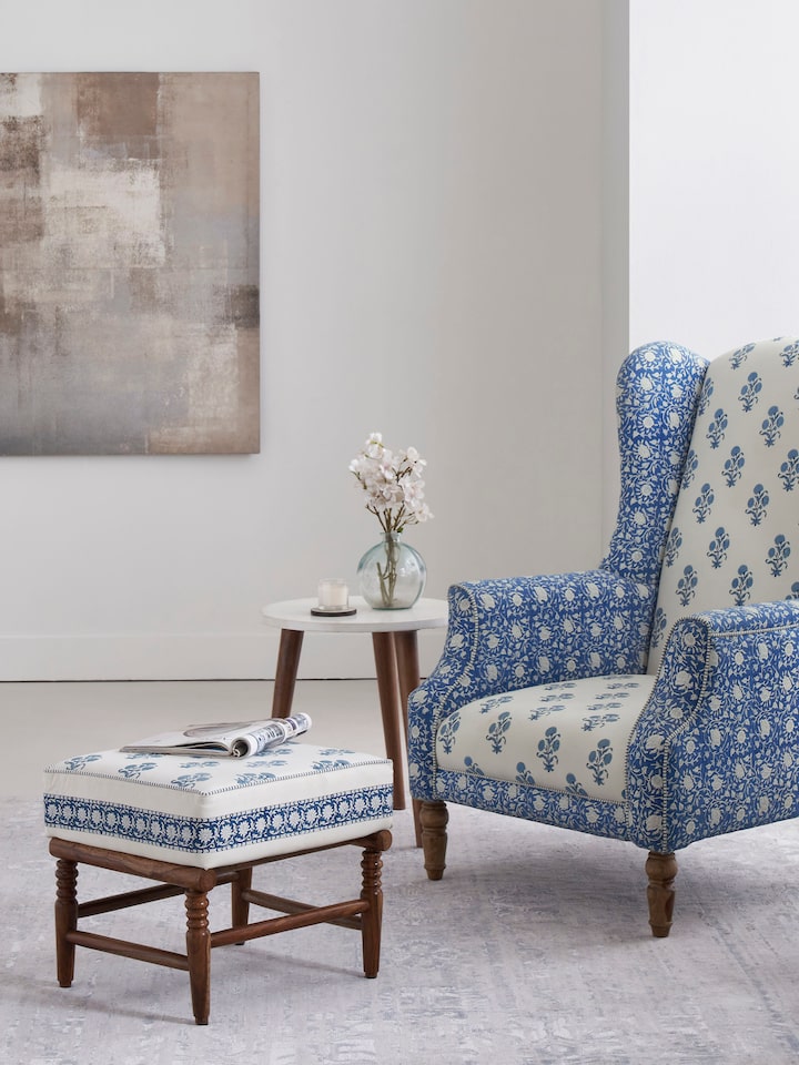 Upholstered Sheesham Wood Sanganeri Block Print Ottoman with intricate block print fabric and sturdy Sheesham wood frame.