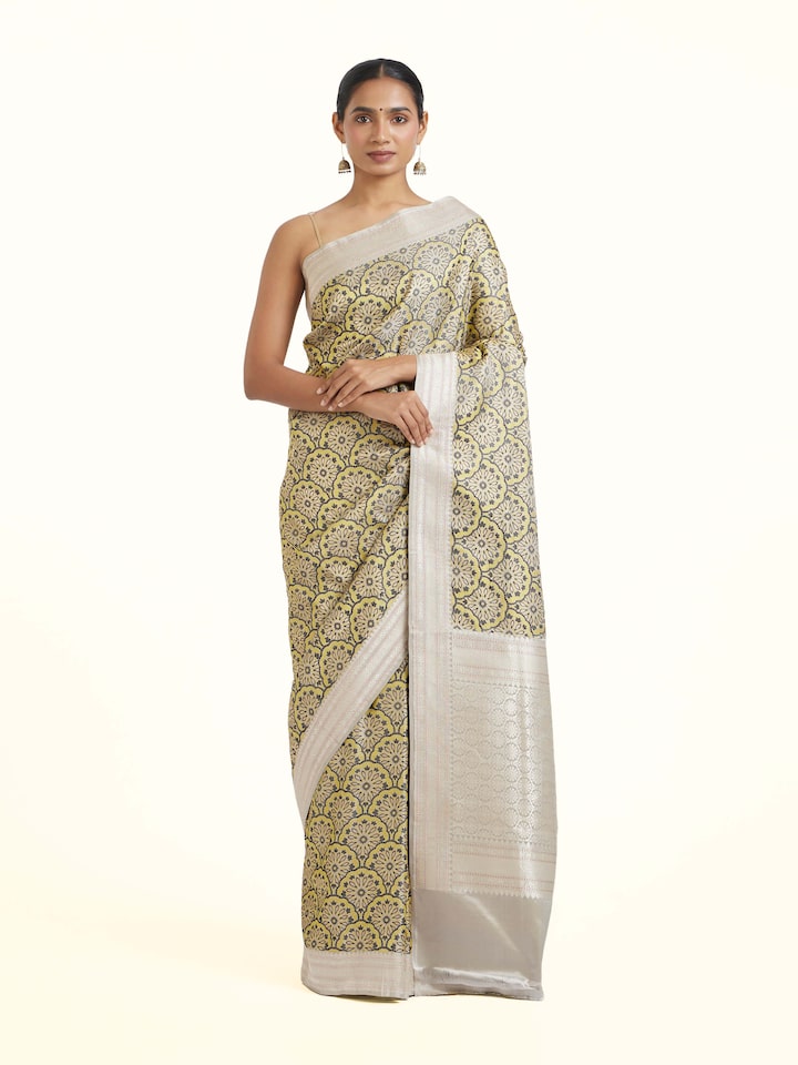 front view of yellow banarasi brocade saree with intricate design
