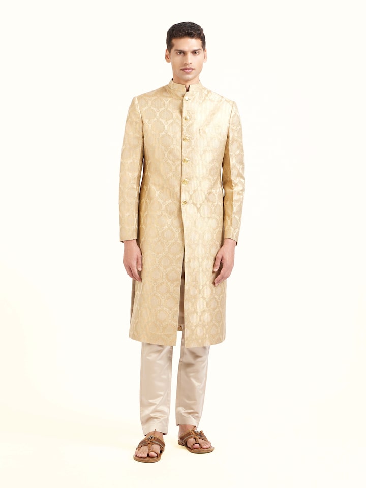Front view of beige silk traditional butidar Banarasi handloom brocade men’s sherwani with ornate motifs
