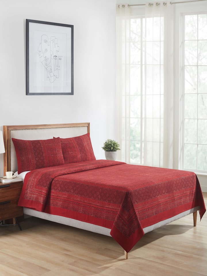 Detailed close-up of Sindh maroon jaal cotton ajrakh block printed queen bedspread set (3 pcs) highlighting the ajrakh print and cotton fabric.