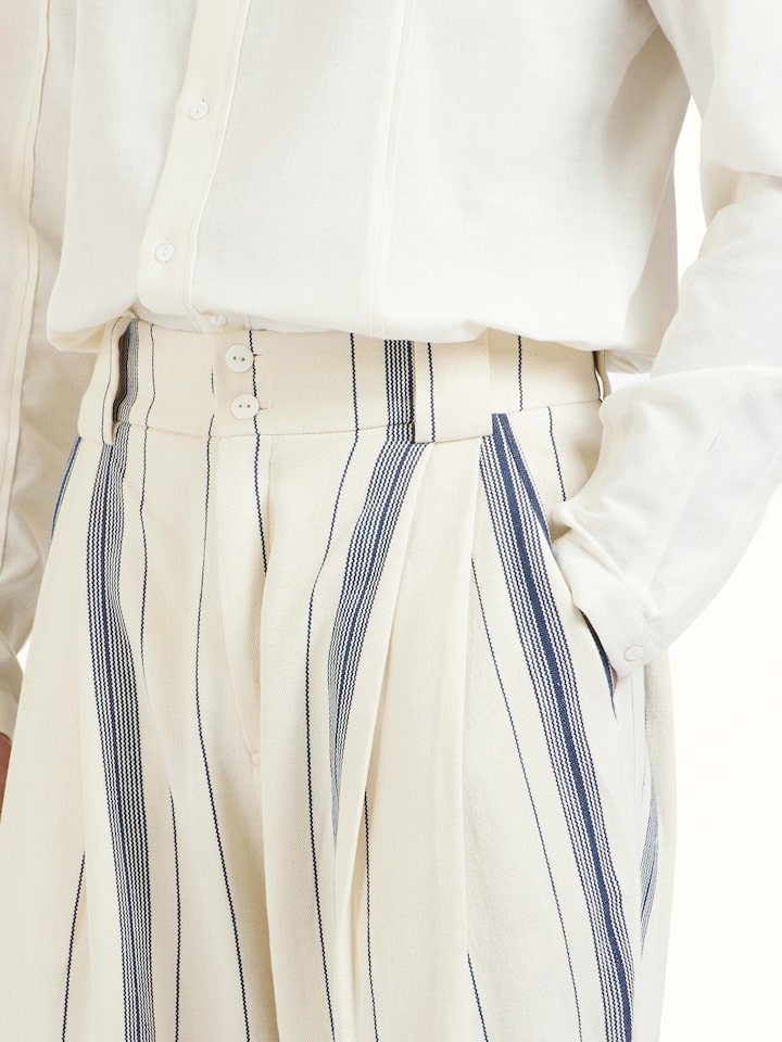 Detail view of ivory cotton handloom straight pants showing fabric texture and craftsmanship