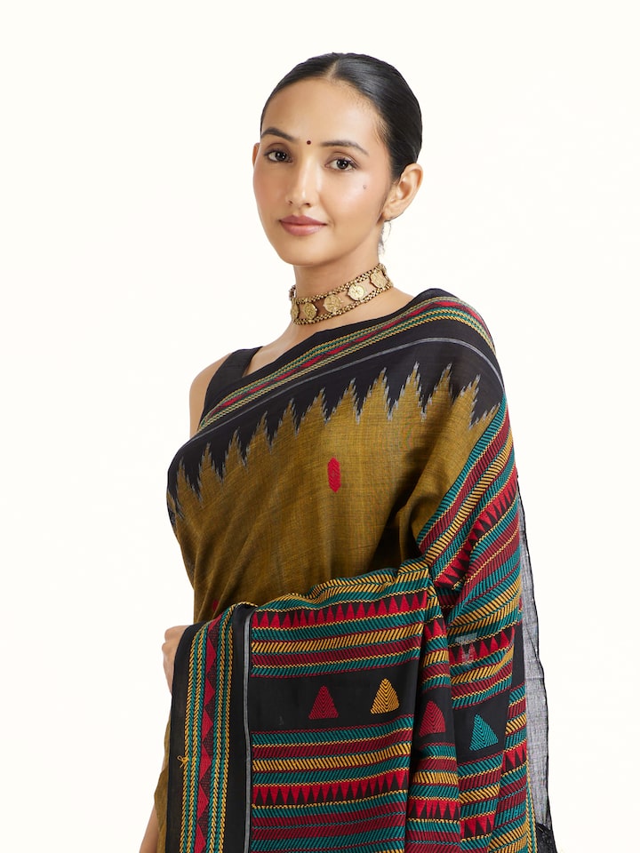 Angled view of Yellow Cotton Dongaria Saree revealing the depth of its color and intricate pattern