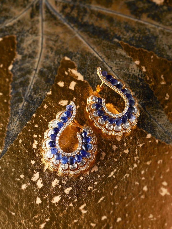 lifestyle view of dank polki 14 karat gold hoop earrings