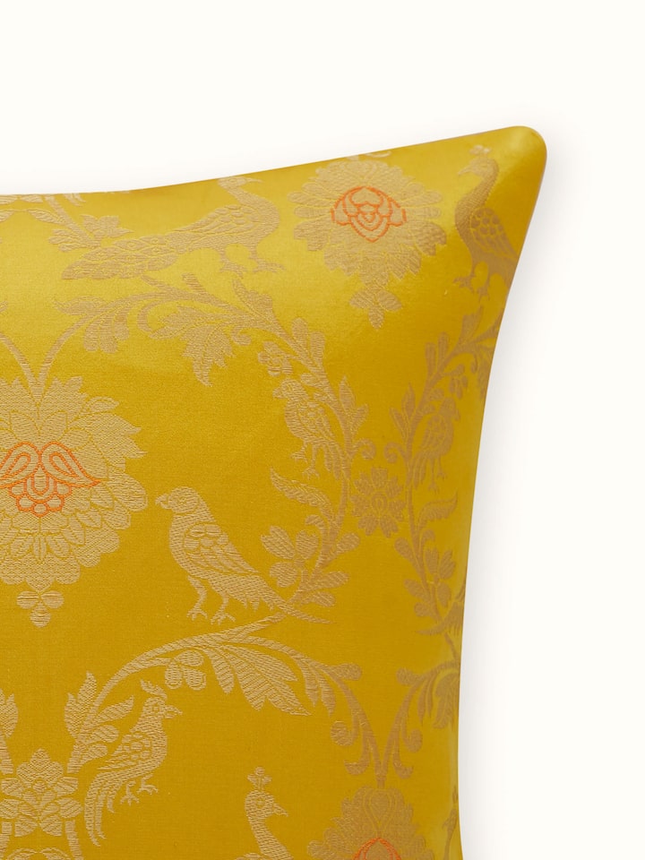 Detail shot of silk weave and elegant border finishing on the cushion cover.