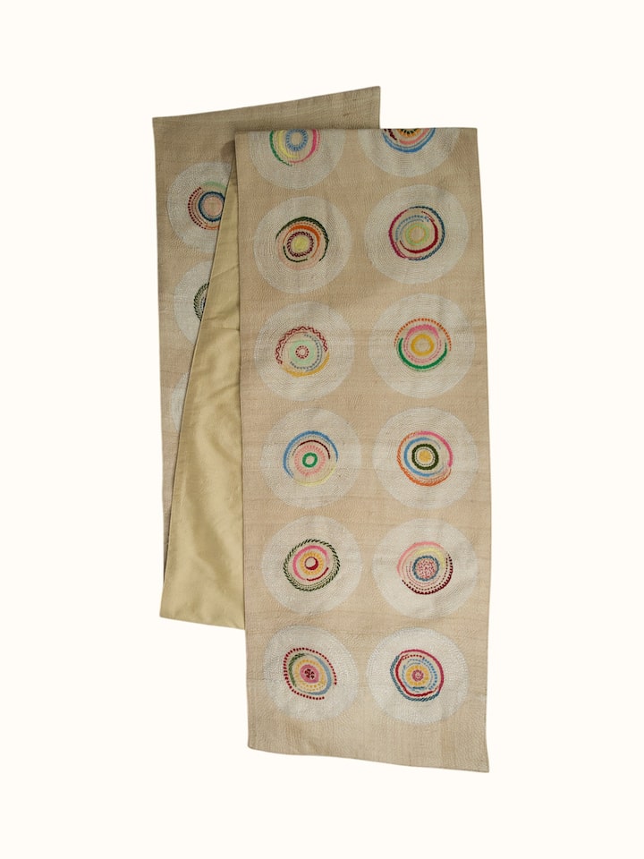Side-angle view of the Bageecha Hand Embriodery Kantha Geo Table Runner