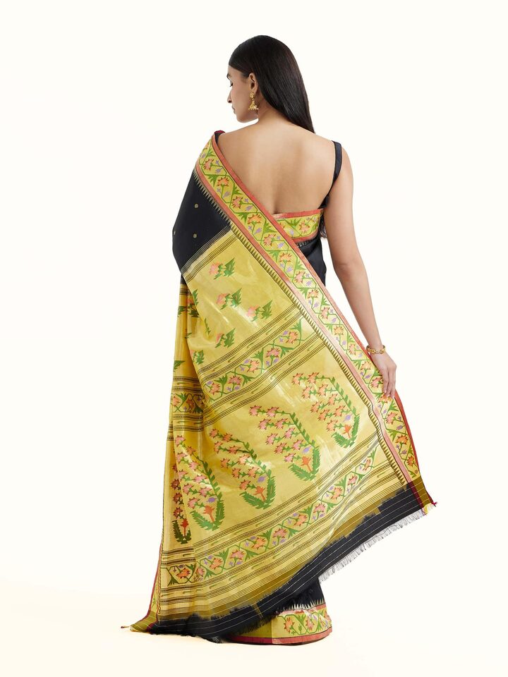 Back view of black silk Paithani saree displaying ornate pallu design