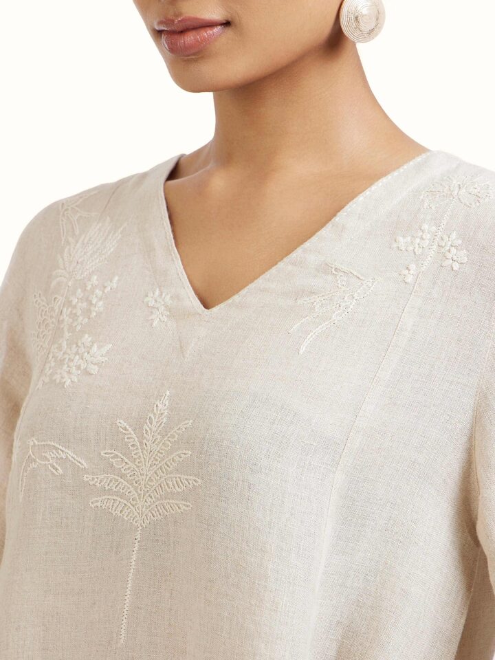 Detail view of Natural Linen Chikankari Dress highlighting the embroidery and stitch detail