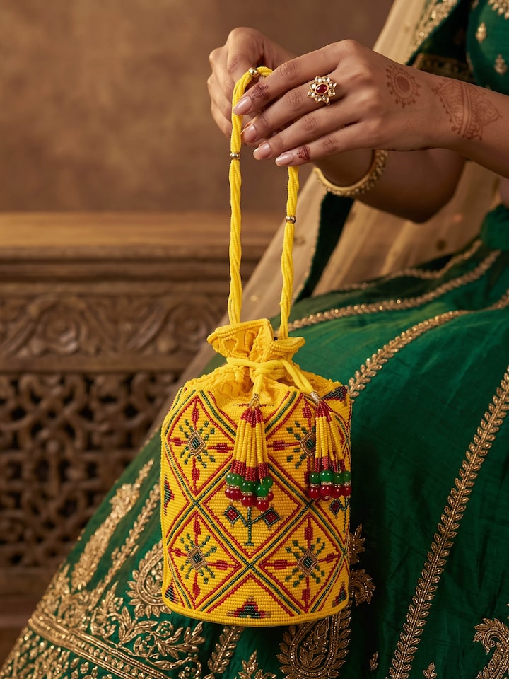 Styled view of Beadwork Yellow Potli Bag styled with an outfit