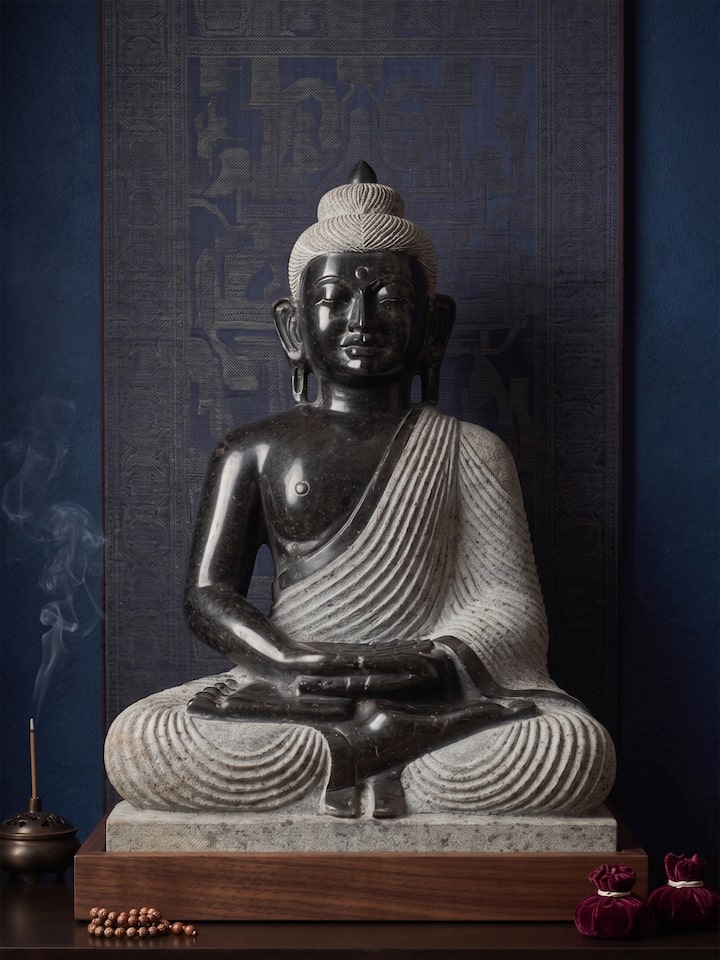 Side view of the Maitreya Carved Stone Buddha Idol
