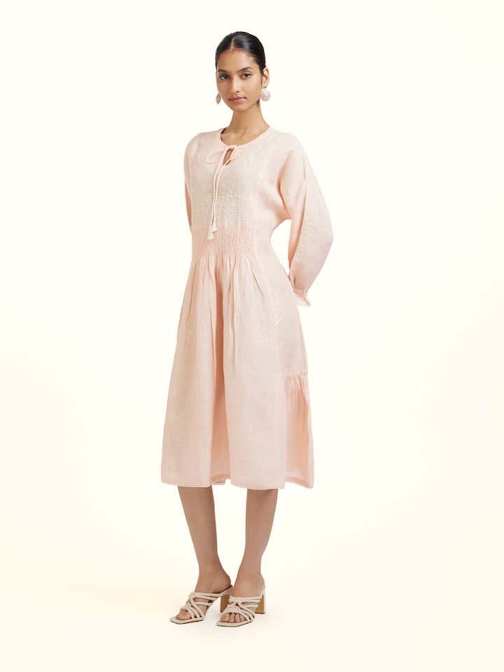 Side view of Peach Linen Chikankari Dress showing the side fit and silhouette