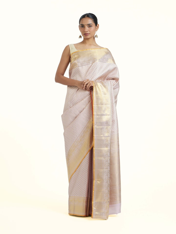 Front view of Light Pink Kancheepuram Silk Zari Saree showcasing its traditional craftsmanship and design