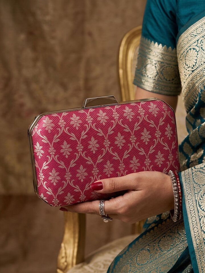 Styled view of Pink Banarasi Silk Clutch showing the bag styled with an outfit