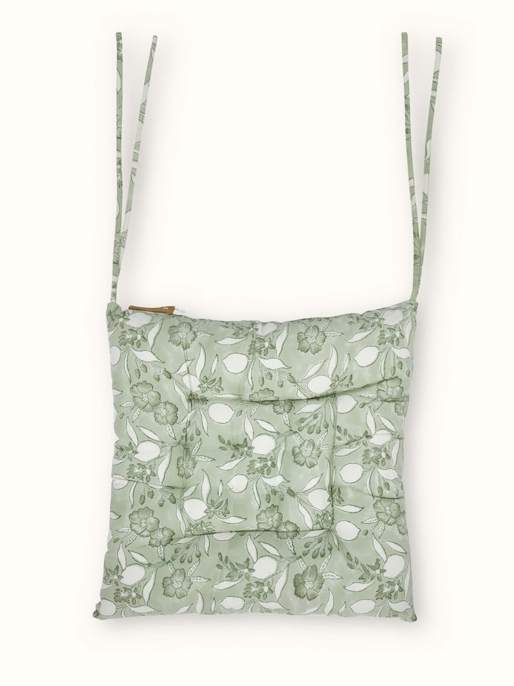 Front view showing the green floral Sanganeri hand block print on cotton fabric