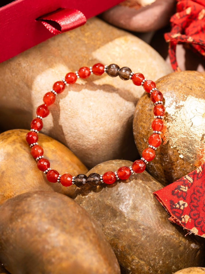 Styled detail view of Carnelian & Smoky Topaz Silver Bracelet shown in another styled shot