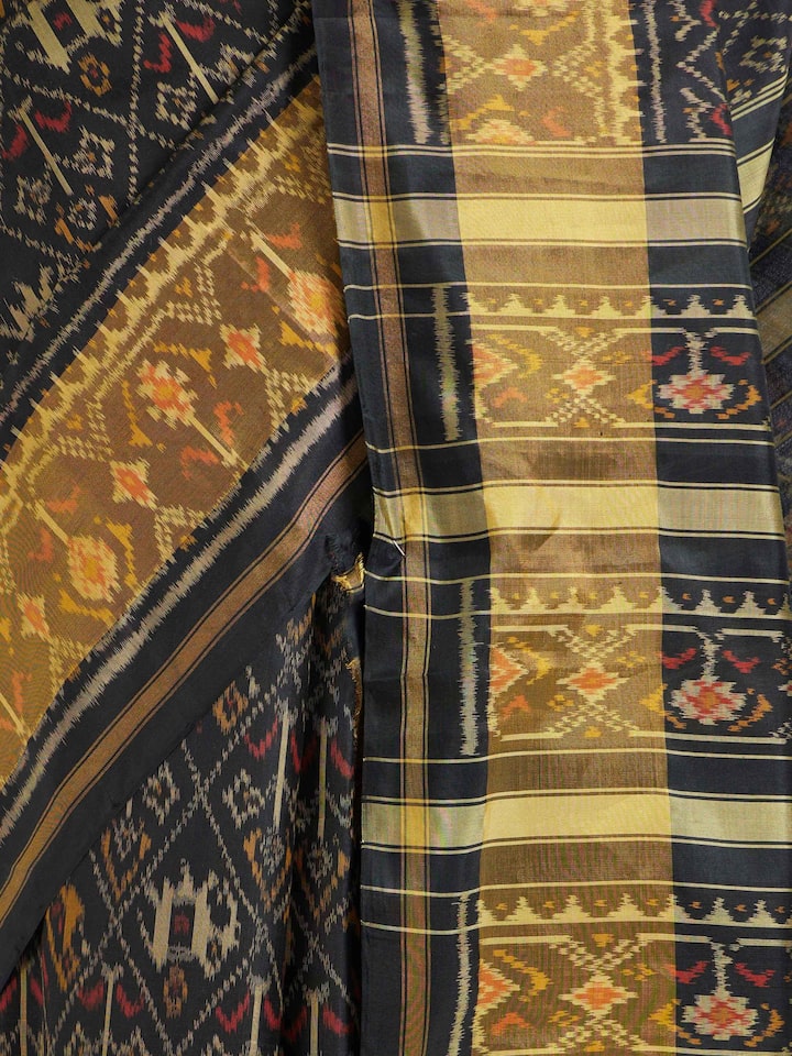Detailed view of Rajkot Patola Ikat Saree focusing on the fine craftsmanship and texture