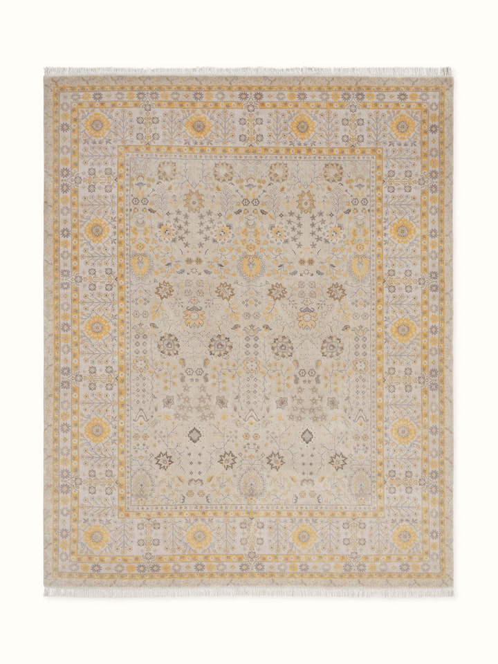 Angled close-up showcasing the intricate hand-knotted wool pattern in grey and gold tones