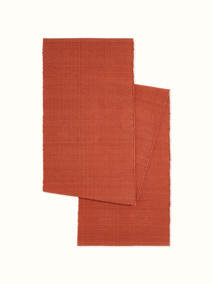 Front view showcasing the rich rust color and fine handloom cotton texture