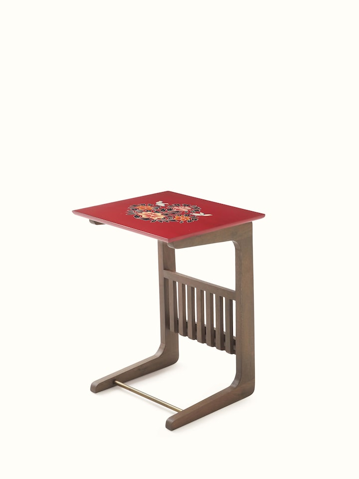 Close-up of the miniature painting details on the mango wood table with shelf