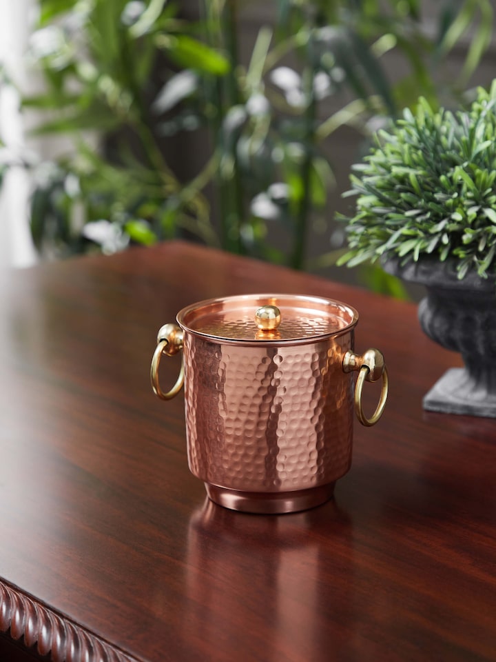 Side view of Copper Ice Bucket by Swadesh displaying the well-constructed handle and smooth copper surface.