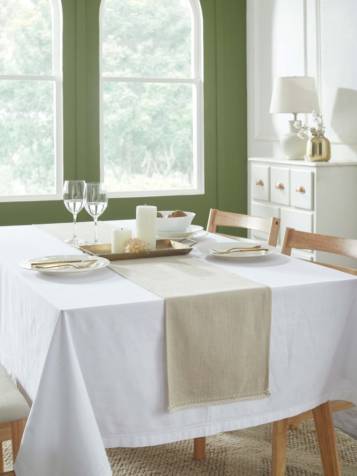 Styled view of Nityam Beige Cotton Slub Crochet Table Runner styled on a table or bed setting