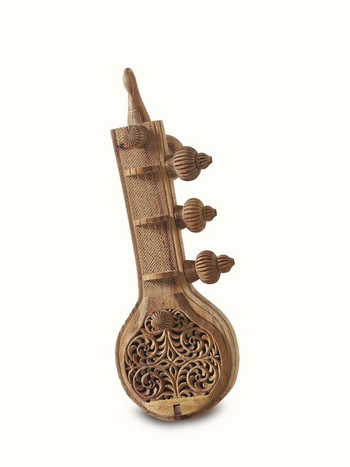 Front view of carved sandalwood Vandana Veena sculpture with intricate carvings