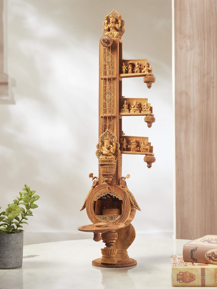 Full view of carved sandalwood veena sculpture, displaying the overall design and craftsmanship.