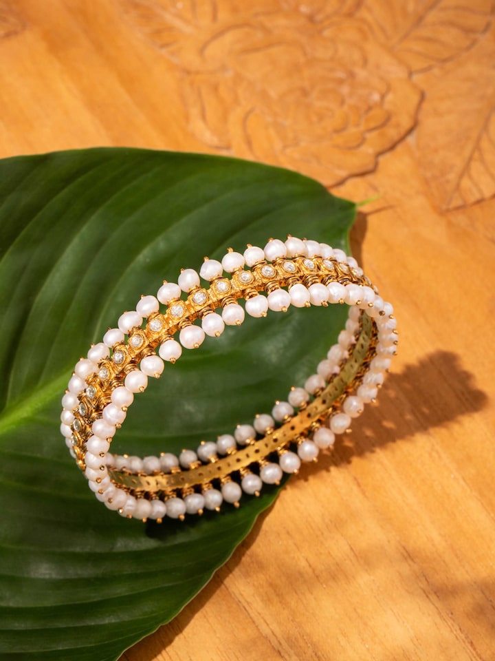 Alternate lifestyle view of Guttapusalu silver bangle paired with festive outfit.