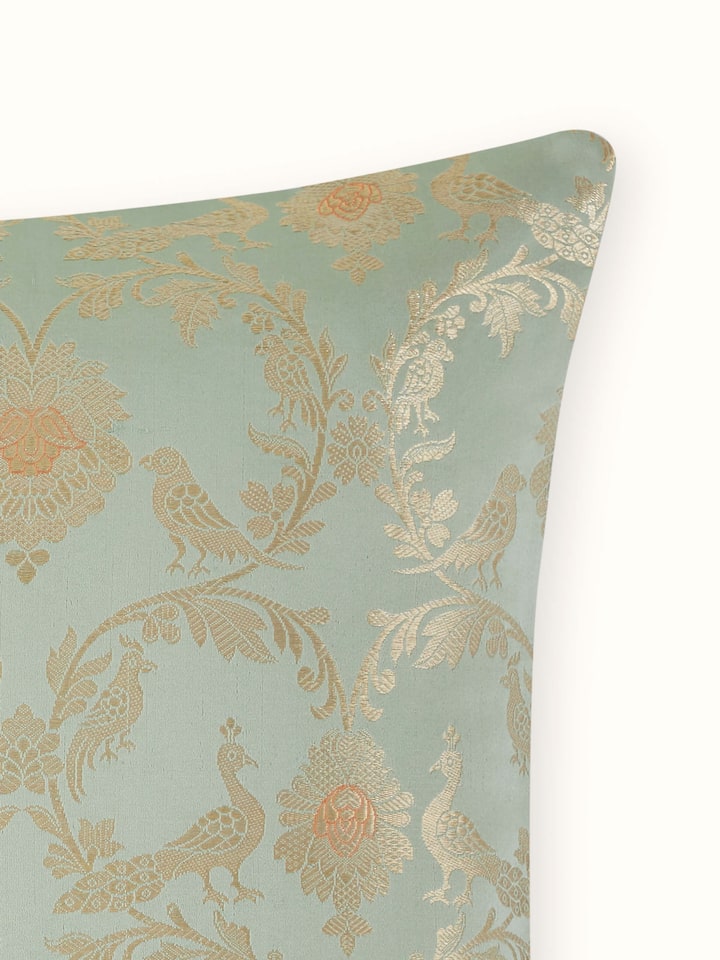 Close-up of cushion cover’s fine detailing and lustrous finish.
