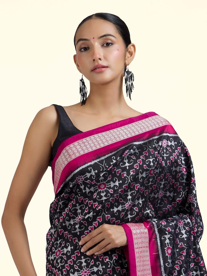 Angled view of black mulberry silk Bandha Odisha Ikat saree emphasizing weaving technique