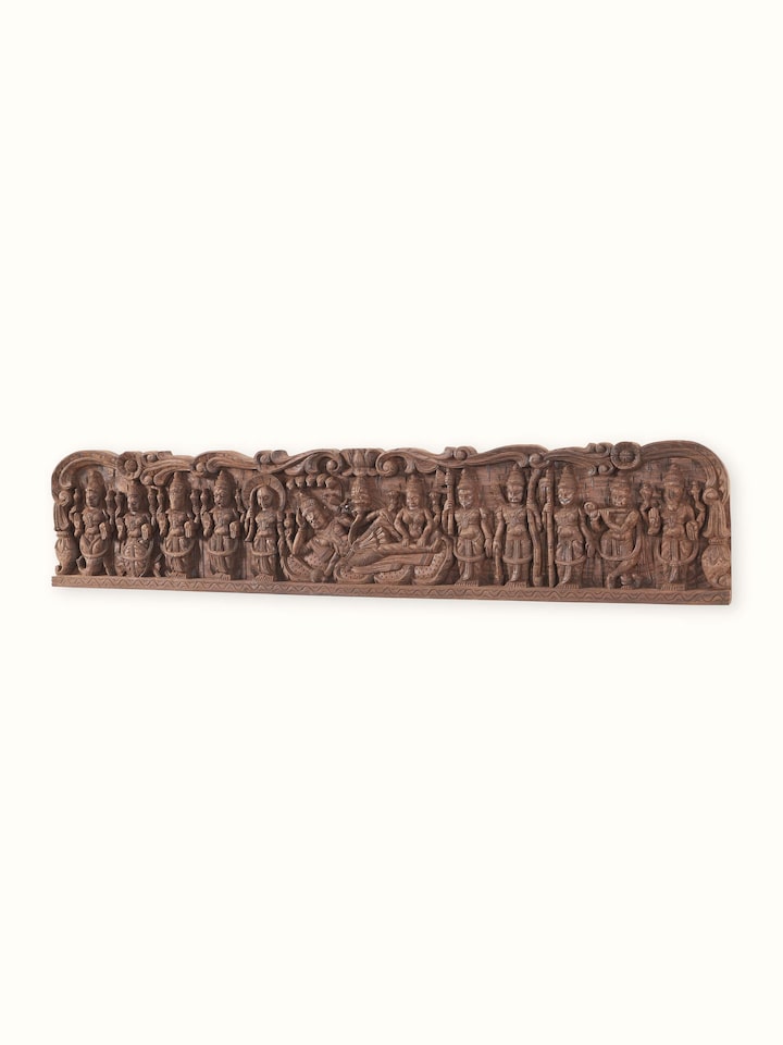 Angled view of the Wood Carved Lakshmi Ganpati Saraswati Idol