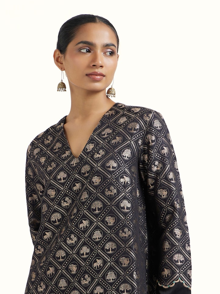 Angled view of black silk Banarasi kurta set emphasizing woven details