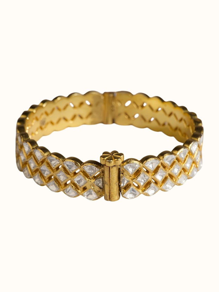 detail view of silver smithing gold plated bangle design
