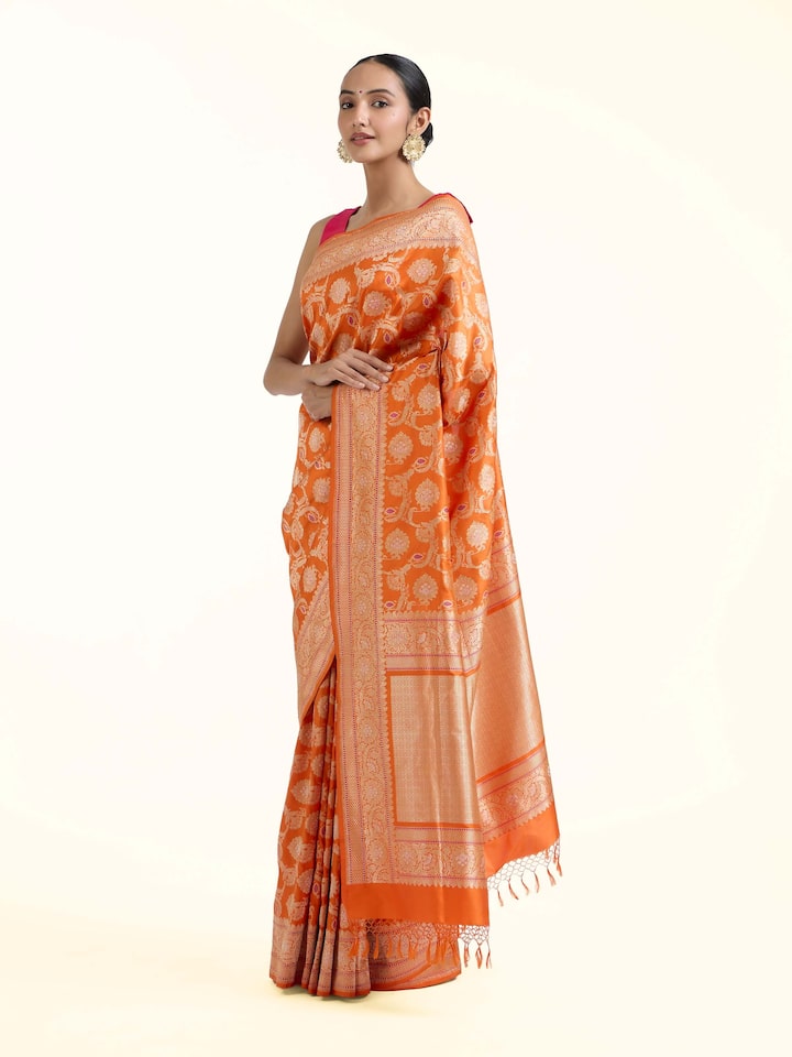 Side view of Orange Banarasi Kadhwa Silk Saree highlighting the detailed craftsmanship and elegant silhouette