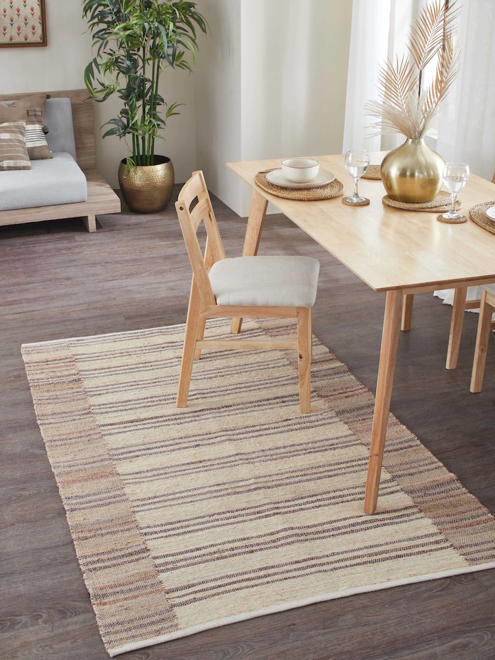 Lifestyle image showcasing Textured Stripes Beige Brown Jute Rug in a contemporary room setting