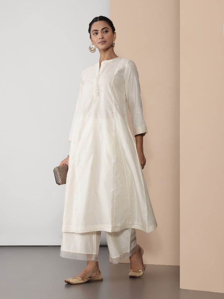 Side lifestyle view highlighting the sheer sleeves and soft drape of the off-white kurta.