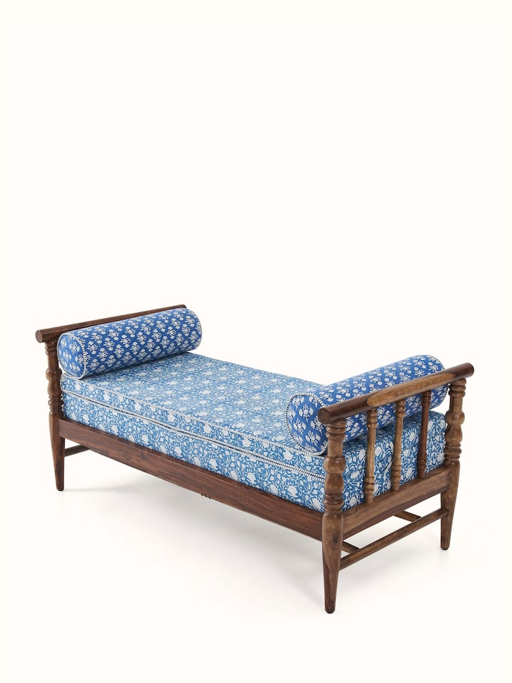 Angled view of Sheesham wood Sanganeri block print bench showing detailed craftsmanship