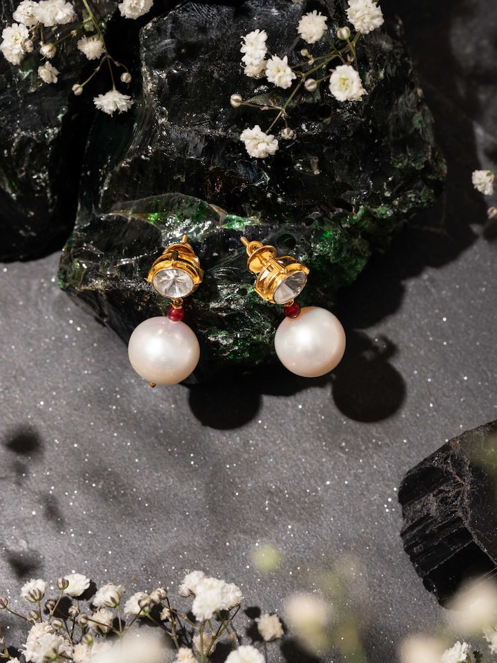 Lifestyle view of Polki gold drop earrings with radiant sparkle and royal elegance