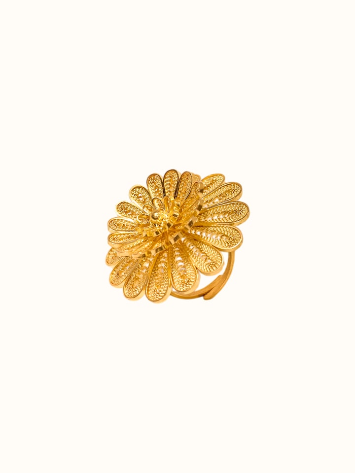 Close-up of Silver Smithing Ring highlighting the detailed petal engraving