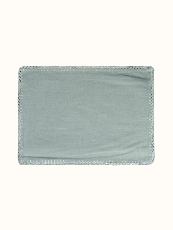 Detail view of Nityam Beige Cotton Slub Crochet Table Mat Set Of 2 highlighting the fabric texture and embroidery detail