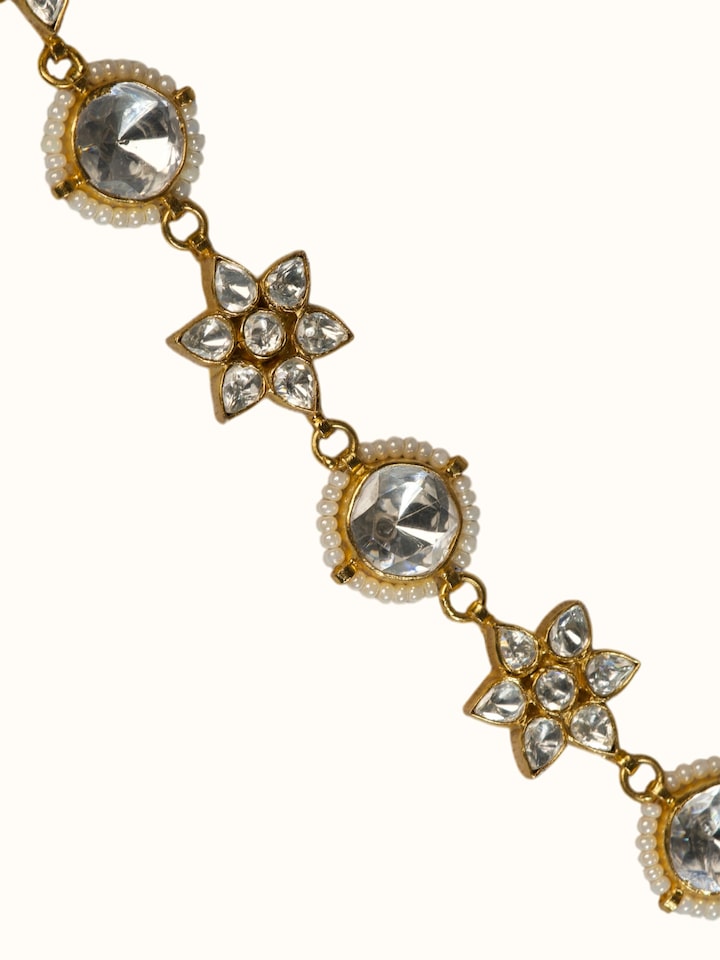 close-up view of silver smithing pure gold plated waistbelt detailing